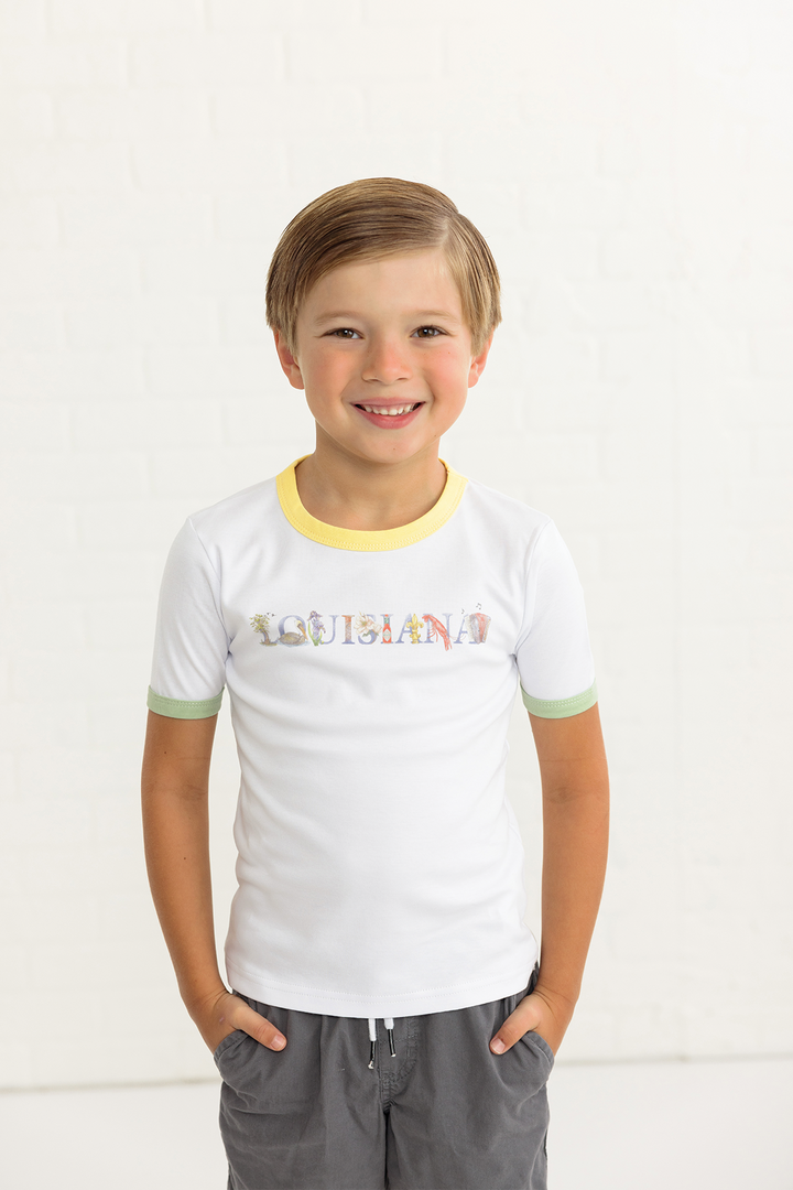 White organic cotton kids tee with yellow trim, green sleeve cuffs, and Louisiana front graphic