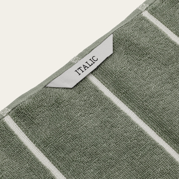 Sage green cotton towels with ecru trim and ITALIC woven label
