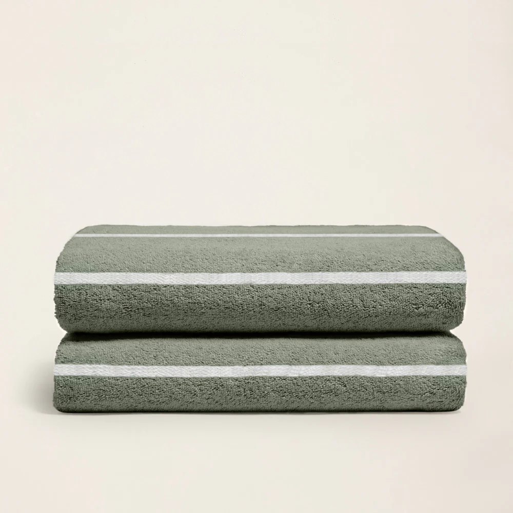 Pair of sage green cotton towels with ecru horizontal stripe bands