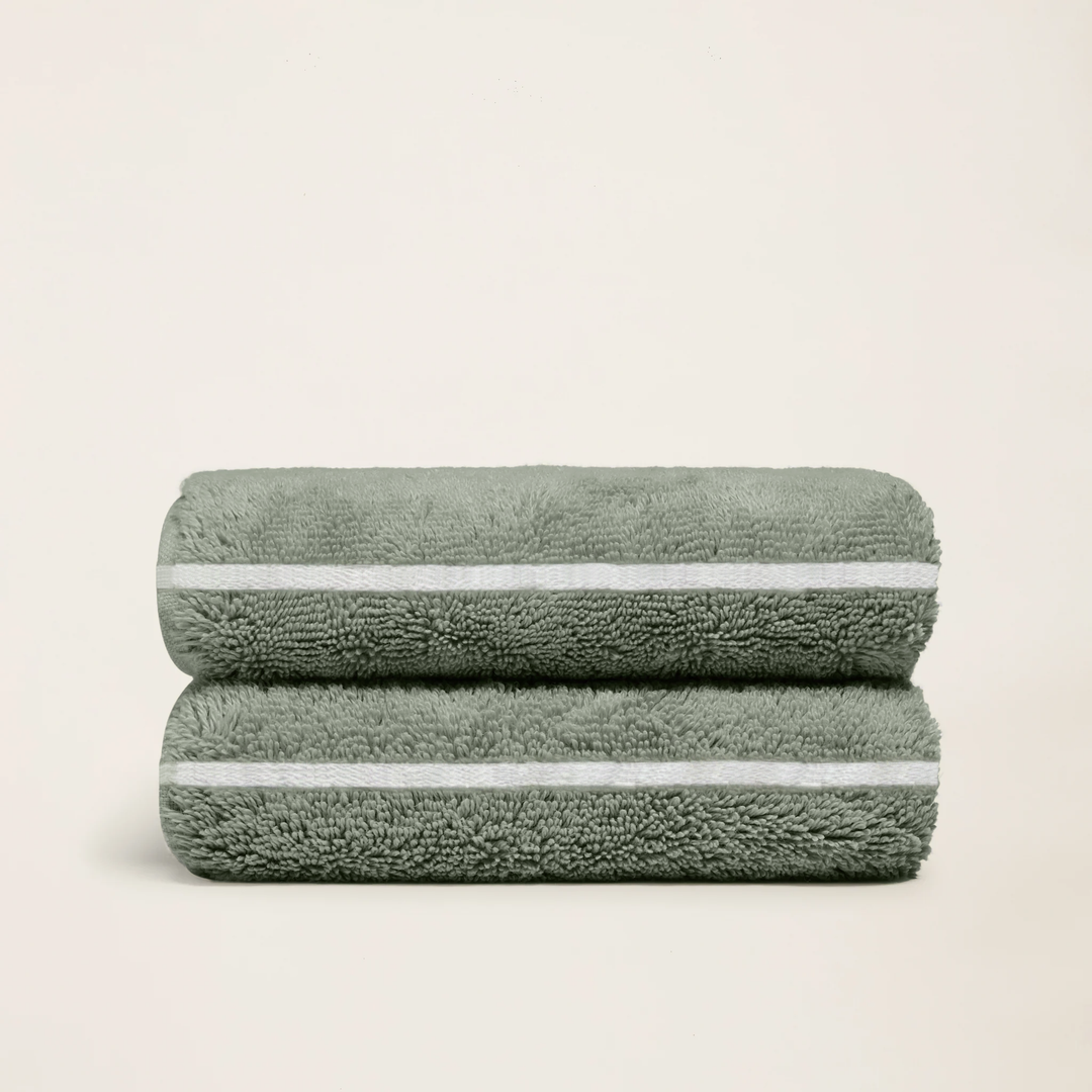 Sage-green cotton towels, set of 2, neatly folded with white stripe borders
