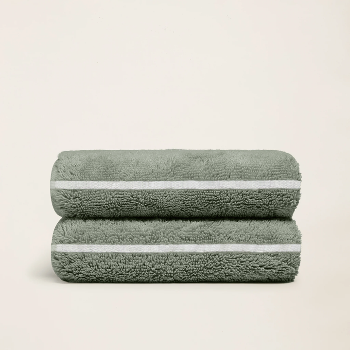Sage-green cotton towels, set of 2, neatly folded with white stripe borders