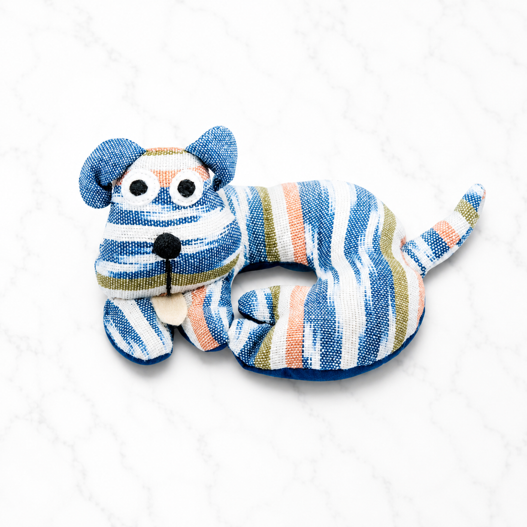 Fabric dog-shaped trivet with blue, white, and orange striped fabric and floppy ears
