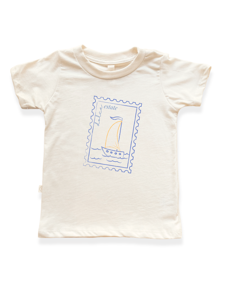 Kids organic cotton T-shirt in light cream with sailboat stamp graphic