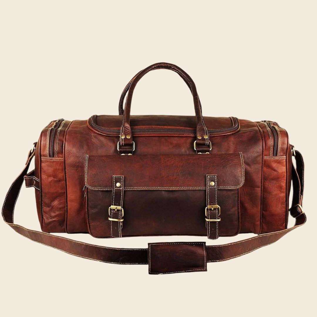 Brown leather weekender duffel bag with stitched front flap and metal buckle details