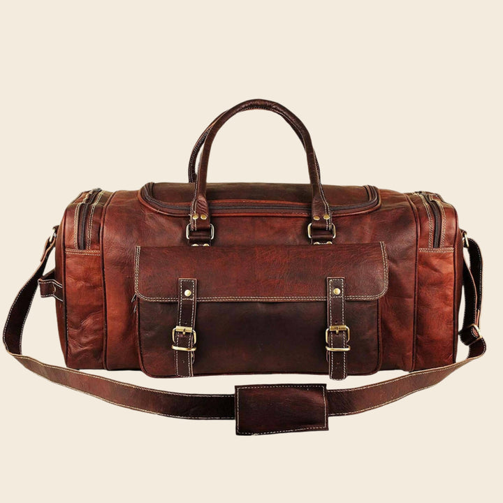 Brown leather weekender duffel bag with stitched front flap and metal buckle details