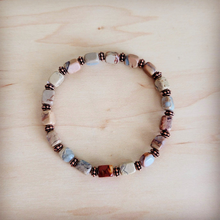 Stretch beaded bracelet with aqua, copper-toned beads and silver spacers