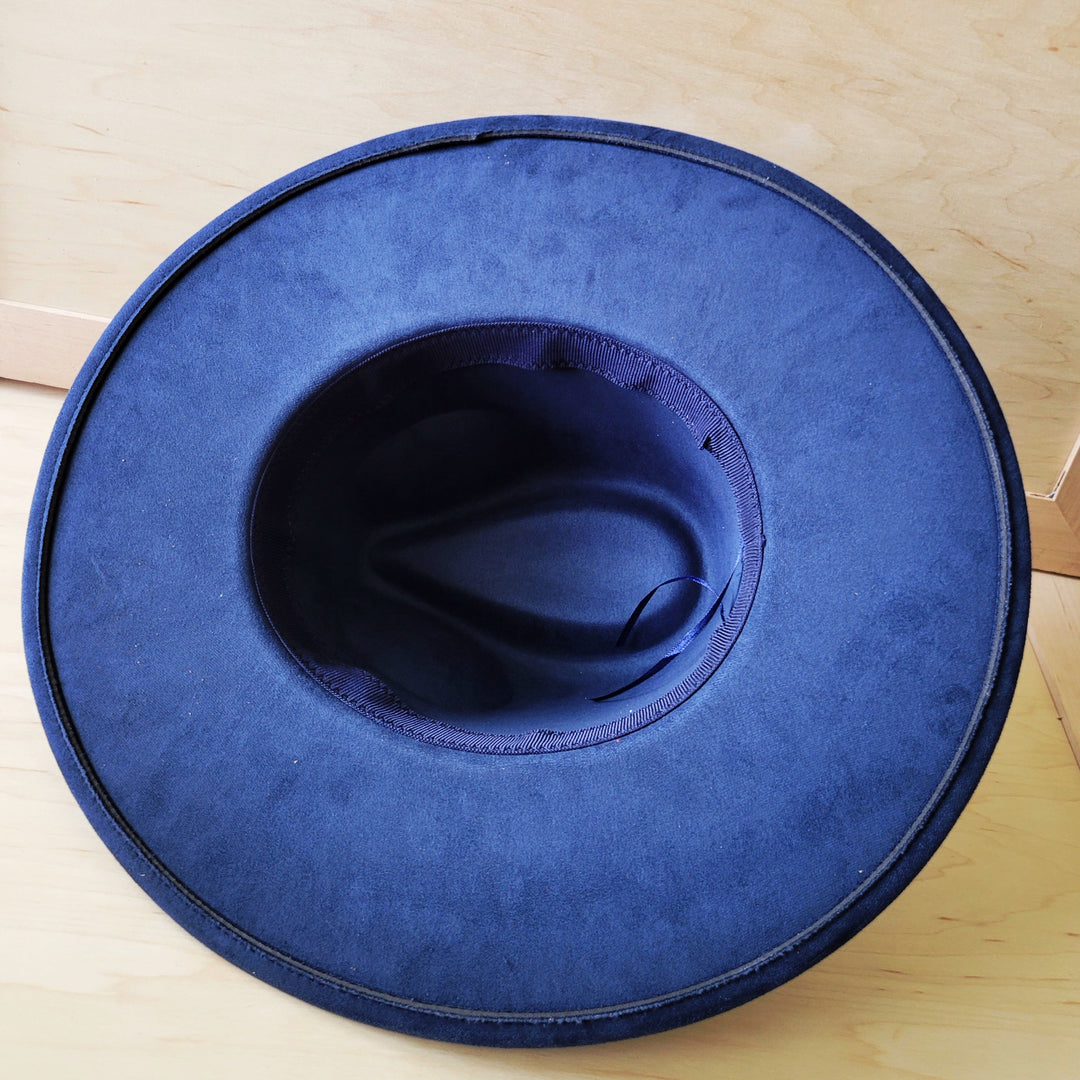Navy blue leopard-print felt cowgirl hat, crown and brim underside view