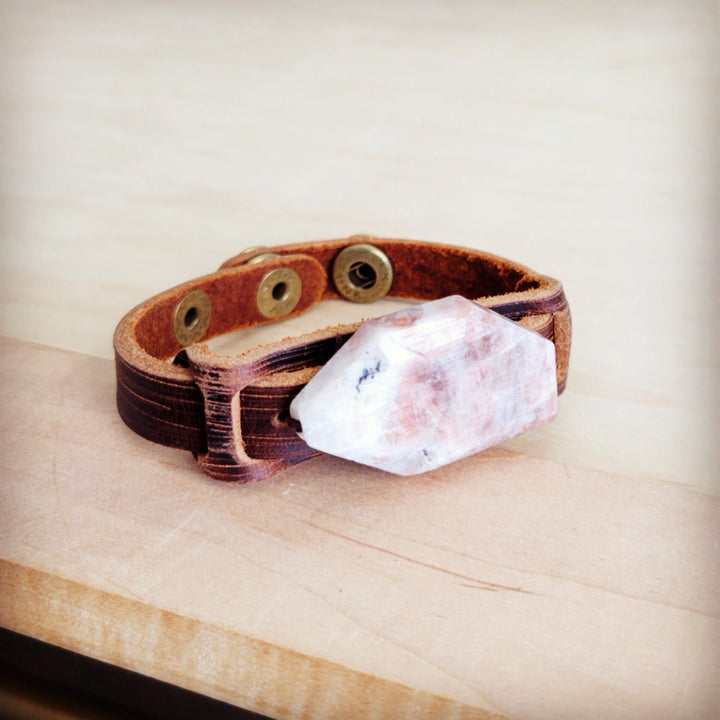 Brown leather cuff bracelet with pink-white crystal and metal studs across top