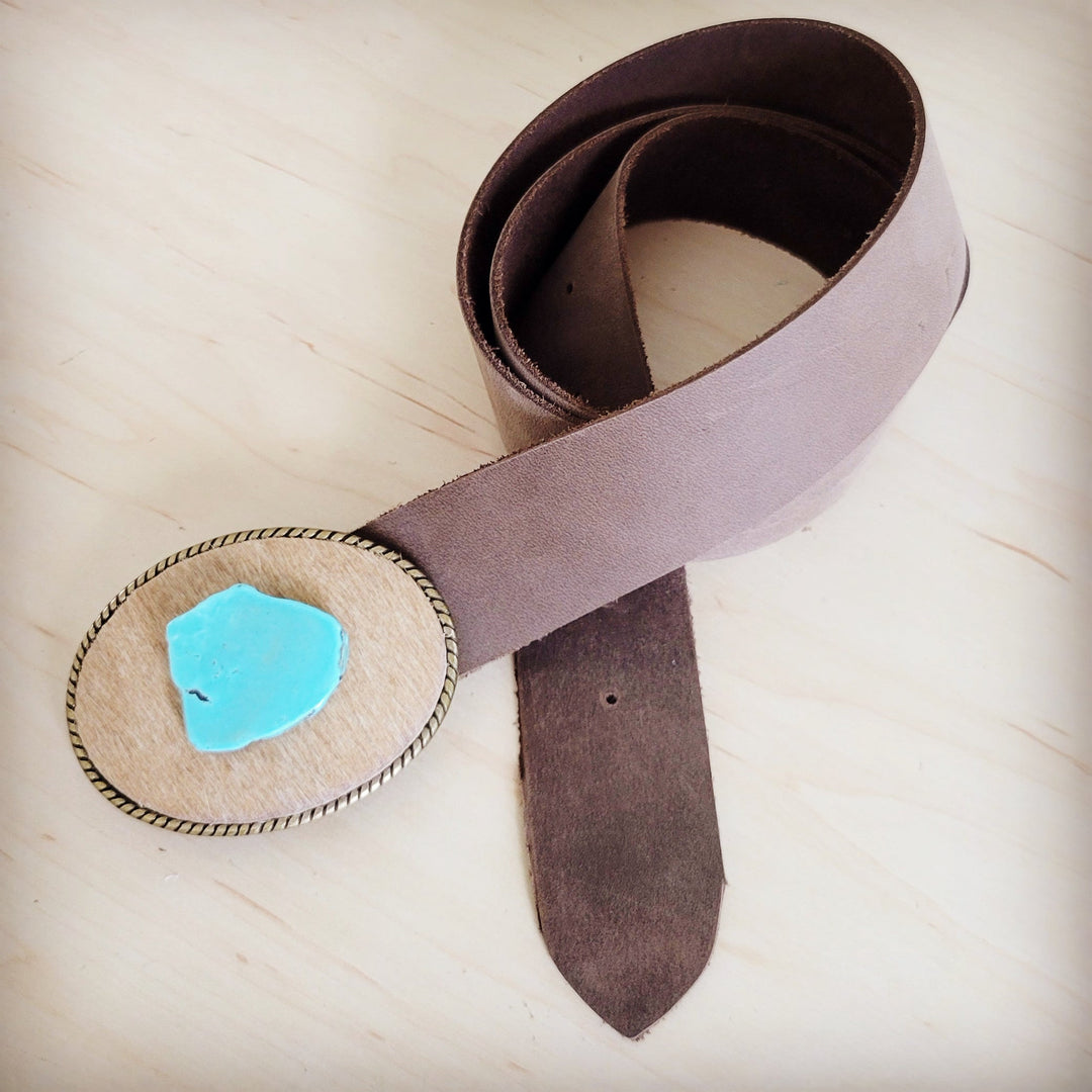 Distressed brown leather belt with turquoise stone buckle accent and metal roller buckle