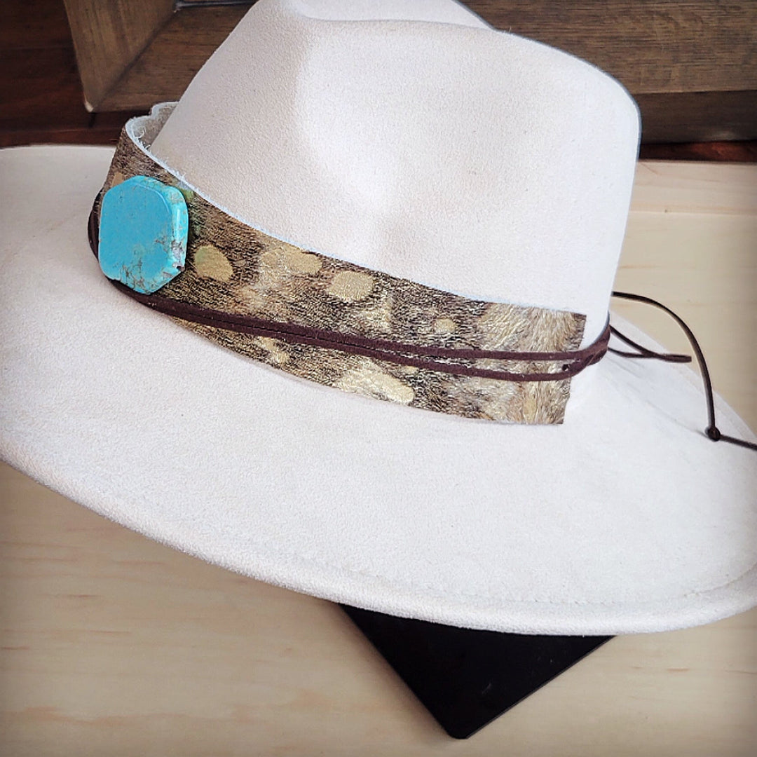 White felt hat with cowhide leather band and turquoise geometric ornament, side angle