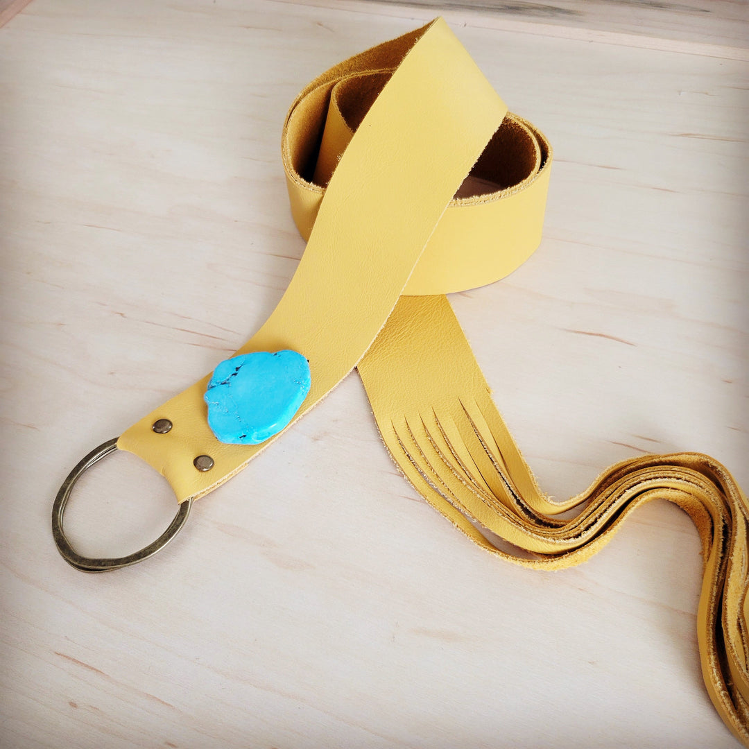 Mustard leather belt with turquoise slab closure and layered fringe strap
