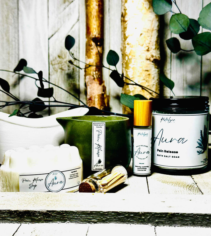 Pain-relieving bath kit with green jar, spray bottle, and roll-on bottles