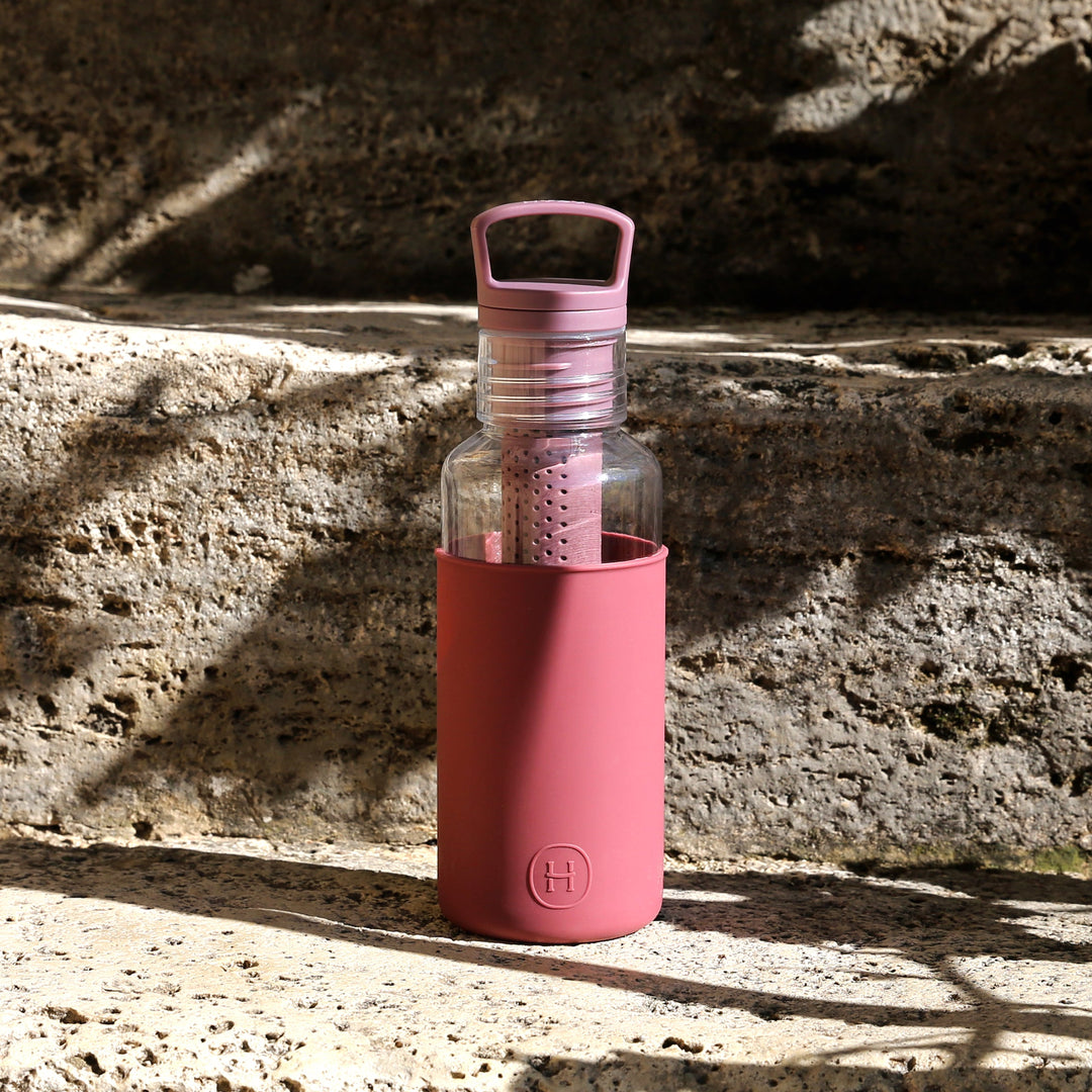 Wine-red 20 oz water bottle with clear body and flip-top carry handle