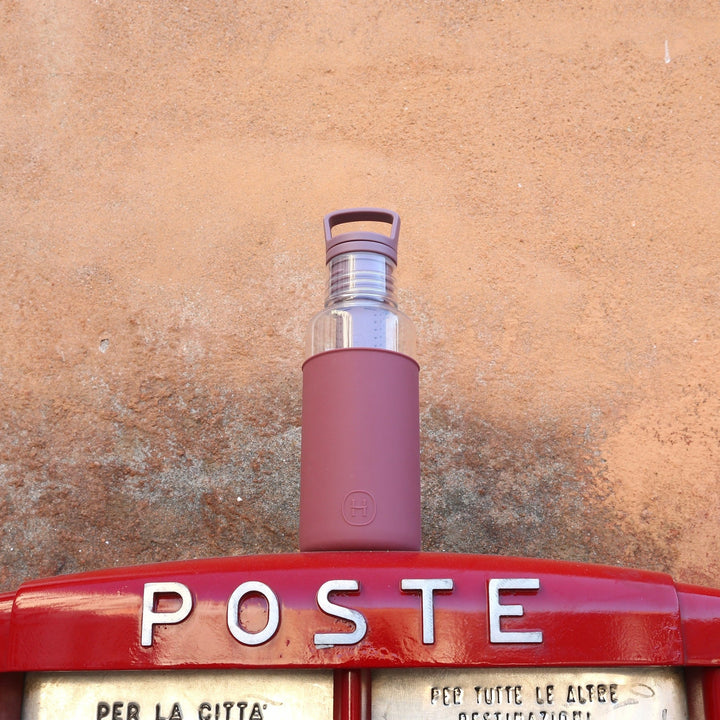 Wine-red 20 oz bottle with flip-top lid and clear upper section