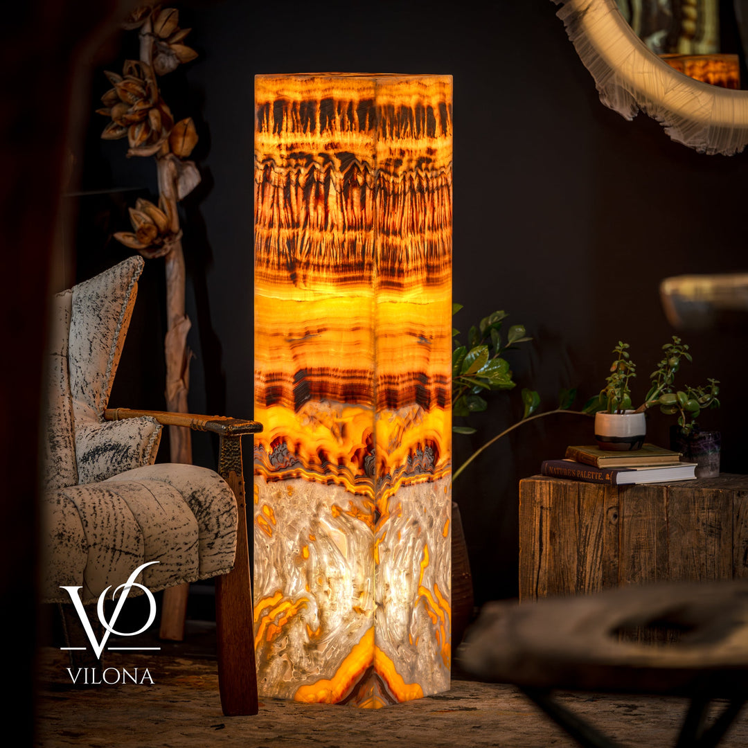 Onyx floor lamp with glowing square shade in golden orange and dark pattern