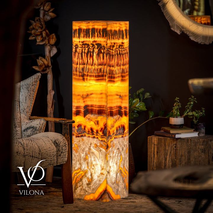 Onyx floor lamp with glowing square shade in golden orange and dark pattern