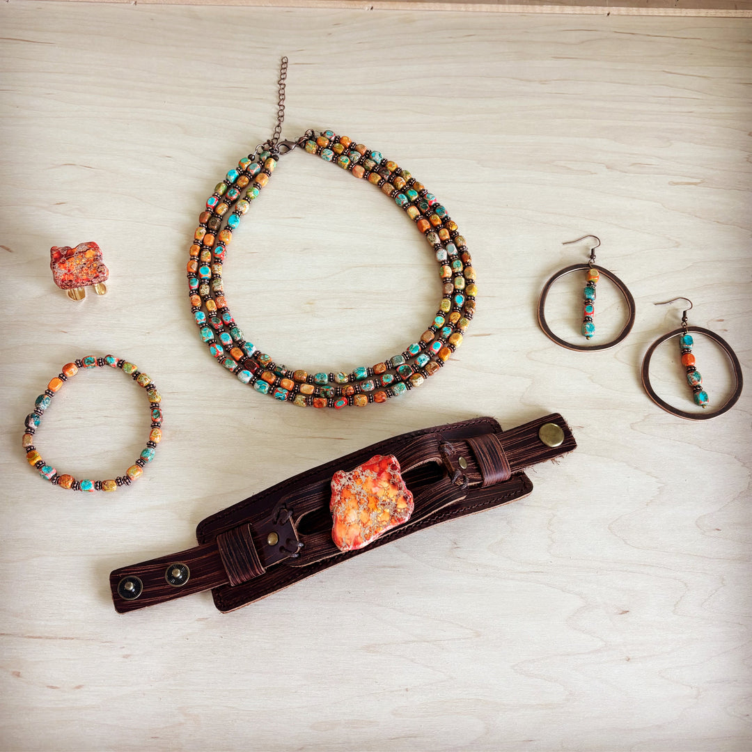 Orange marbled resin statement ring with gold-tone open band
