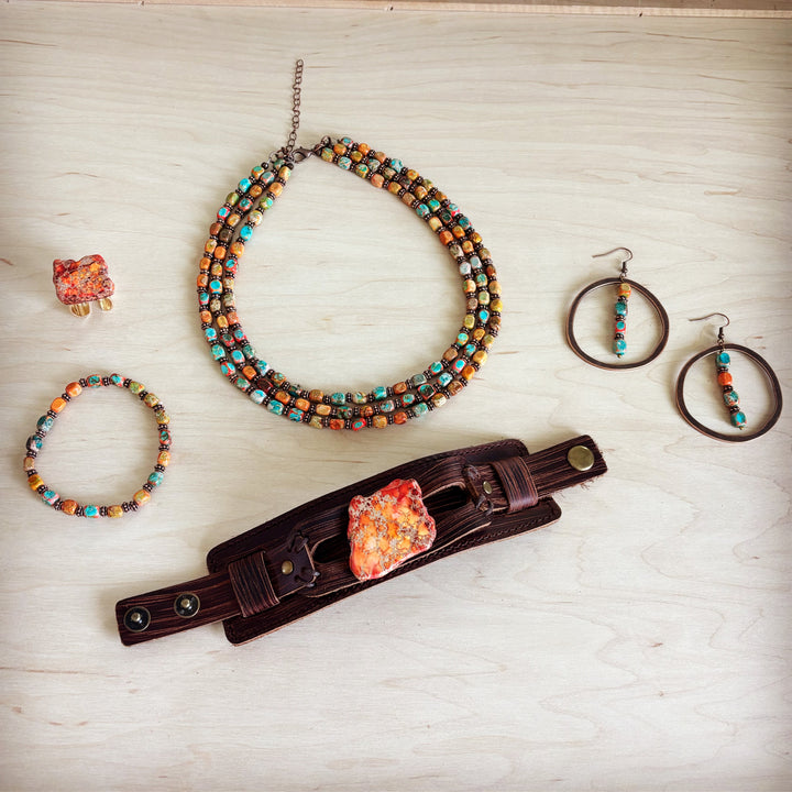 Orange marbled resin statement ring with gold-tone open band