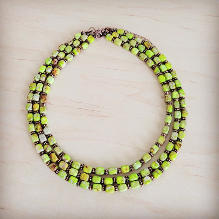 Layered beaded necklace with lime green bead rows and dark brown accents