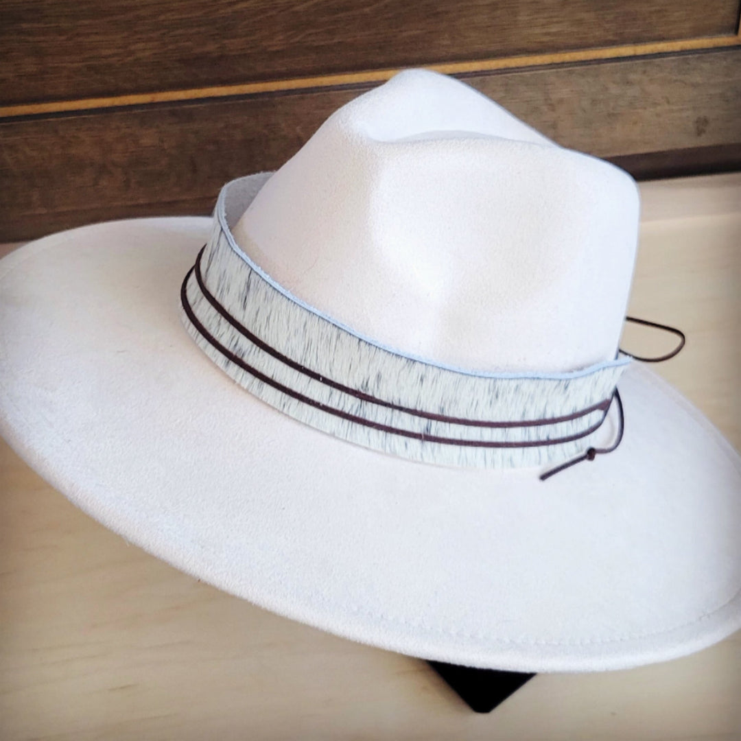White wide-brim felt hat with gray spotted hair-hide band and side tie cords