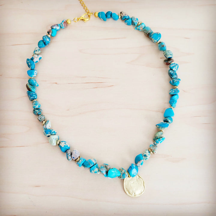 Turquoise beaded collar necklace with round gold coin charm and mixed-texture bead accents