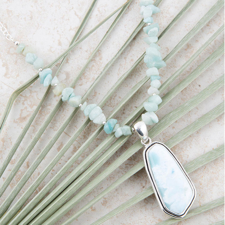 Sterling silver necklace detail: light aqua stone beads with oval light-blue pendant