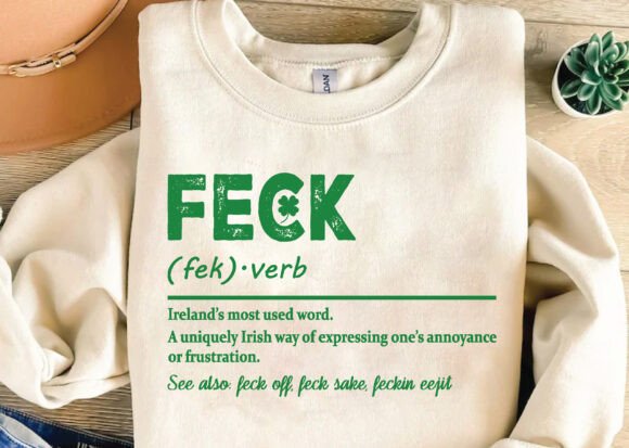 Off-white graphic T-shirt close-up with green "FECK" logo and definition text