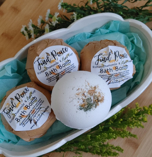 Set of three Chamomile and Sage bath bombs with round kraft labels in a tray