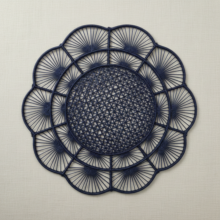 Handwoven iraca placemat in light blue with textured center and radiating woven petals