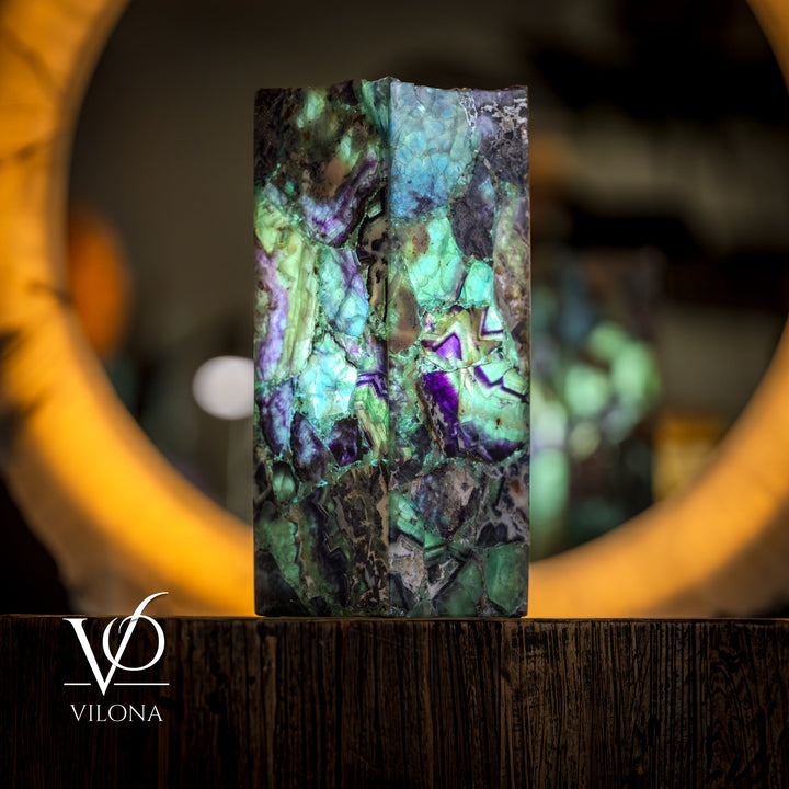 Fluorite table lamp with square live-edge base, glowing aqua-green and purple facets