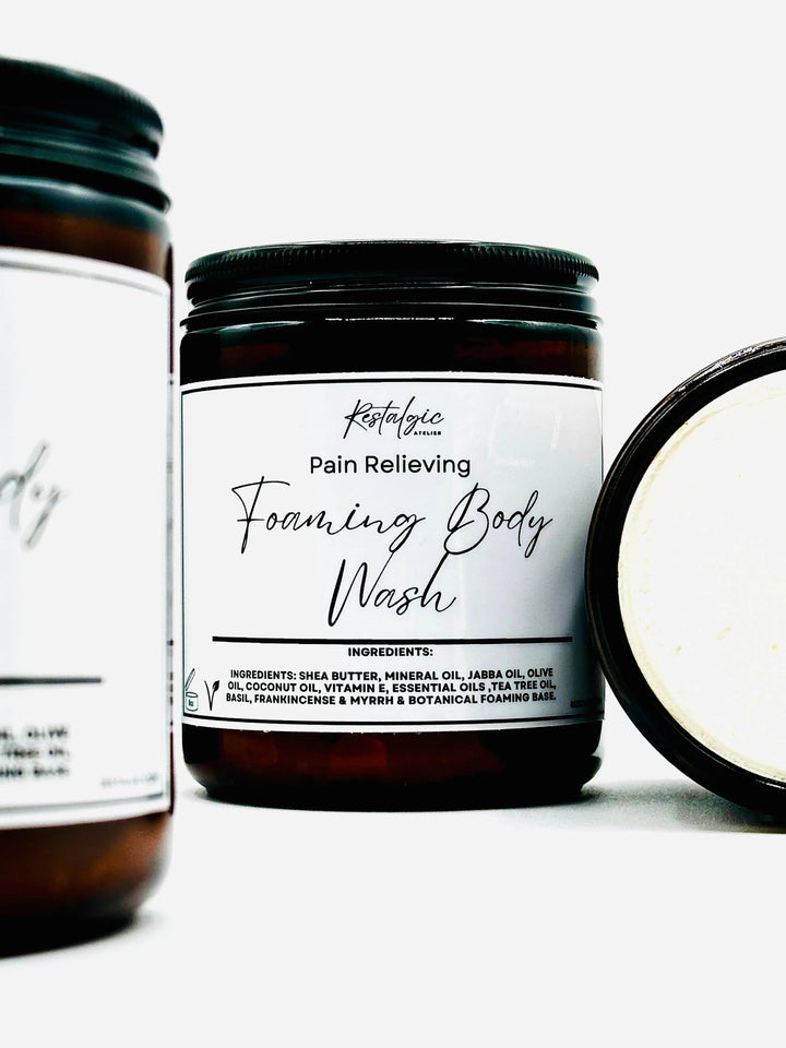 Amber foaming body wash jar with black lid and pain-relieving label
