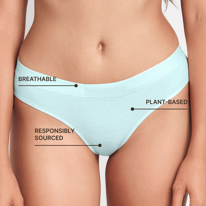 Light blue mid-rise briefs closeup with high-cut legs on model