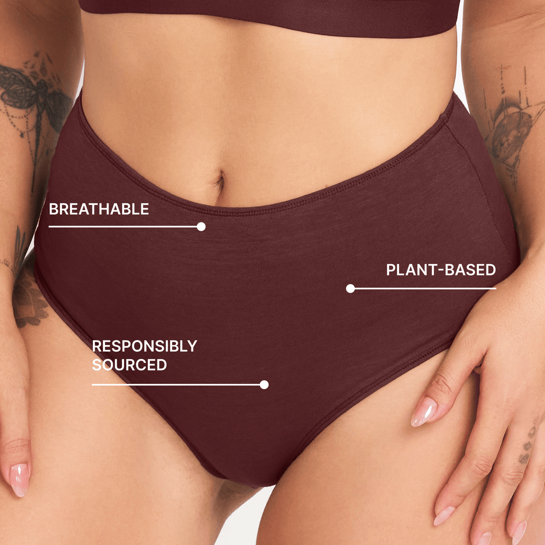 Dark maroon high-rise briefs close-up with breathable knit and front keyhole cutout.