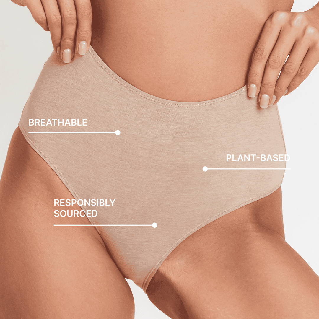Light beige high-rise briefs close-up: breathable knit with front keyhole cutout.