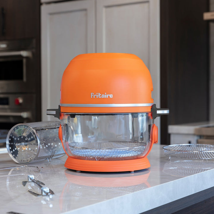 Orange countertop air fryer with clear glass basket and viewing window