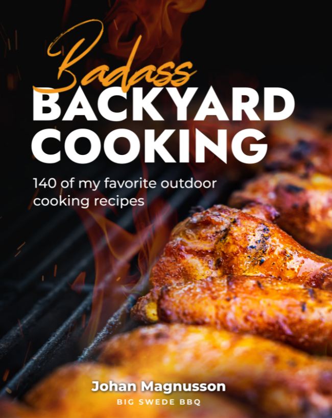 Backyard cooking cookbook cover with grilled meat and flame title