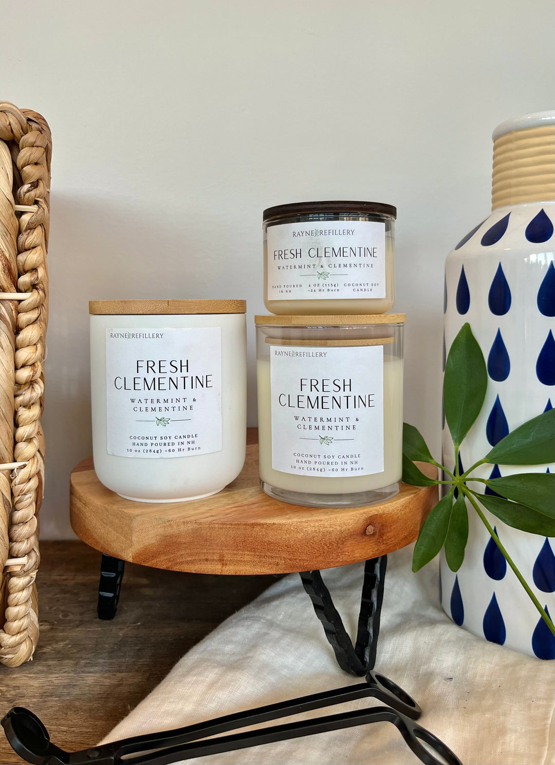 Coconut soy candle with Fresh Clementine label in clear glass jar, light wax