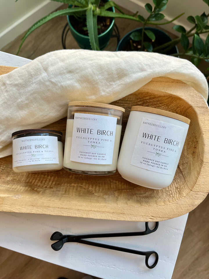 White Birch candle set of three white glass jars on oval wooden tray