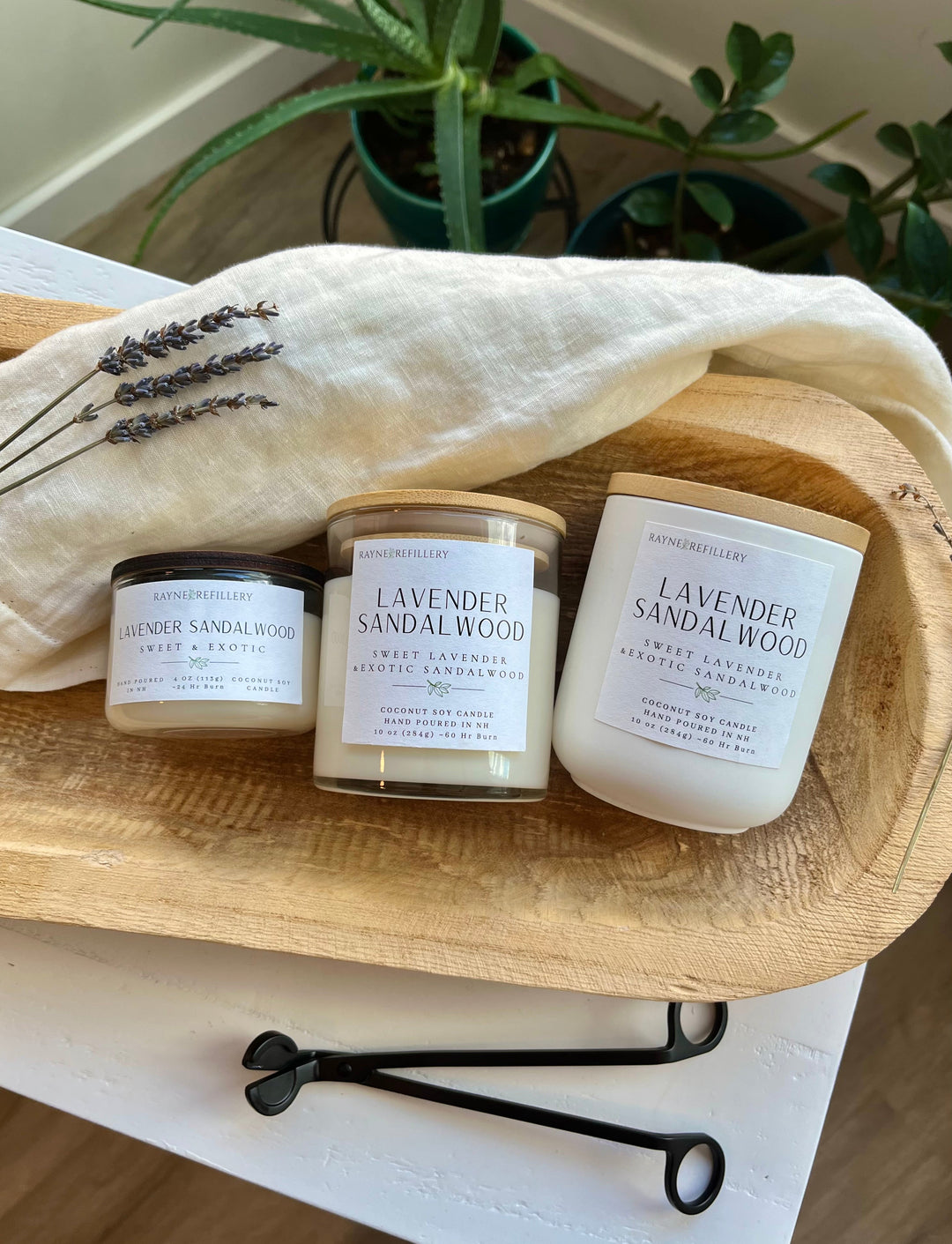 Lavender sandalwood candles set: three white jars with black wick trimmer on tray