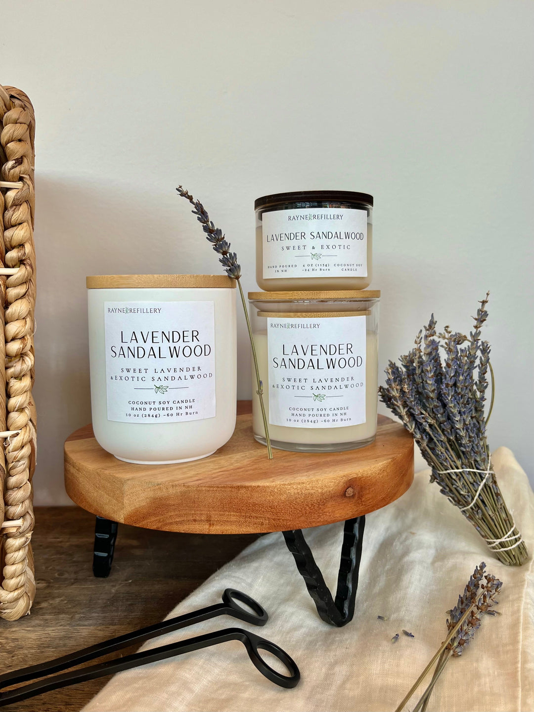 Lavender sandalwood vegan coconut soy candle in white glass jar with wooden tray