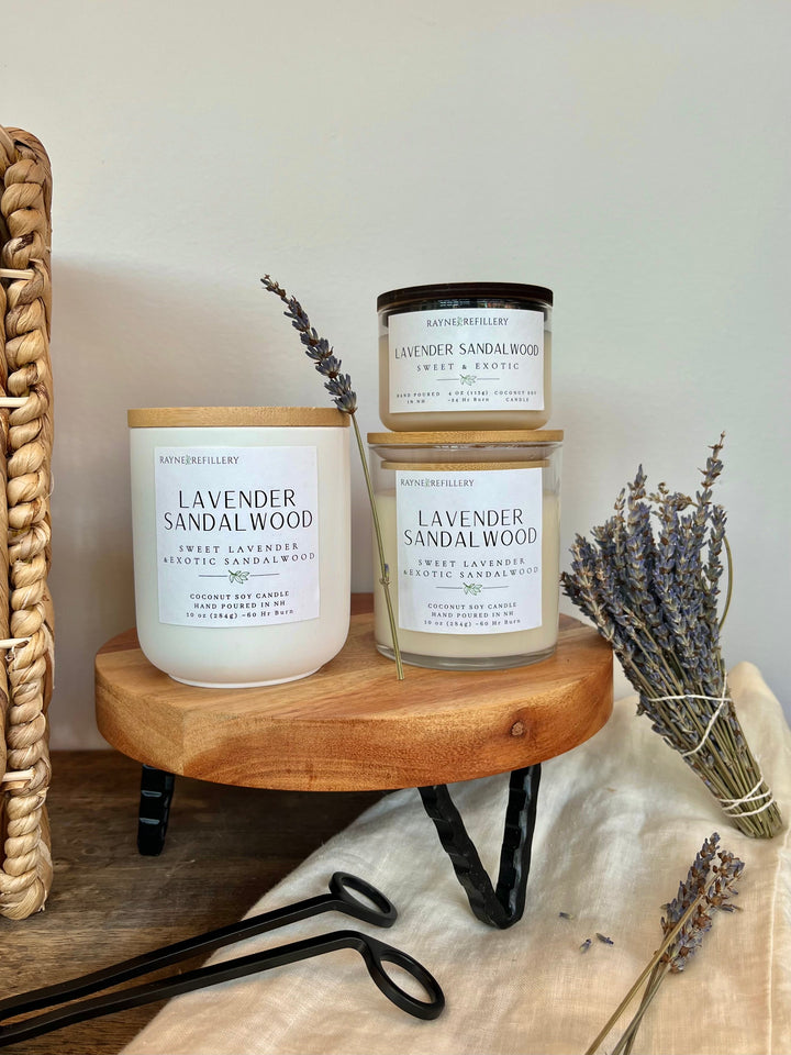 Lavender sandalwood vegan coconut soy candle in white glass jar with wooden tray