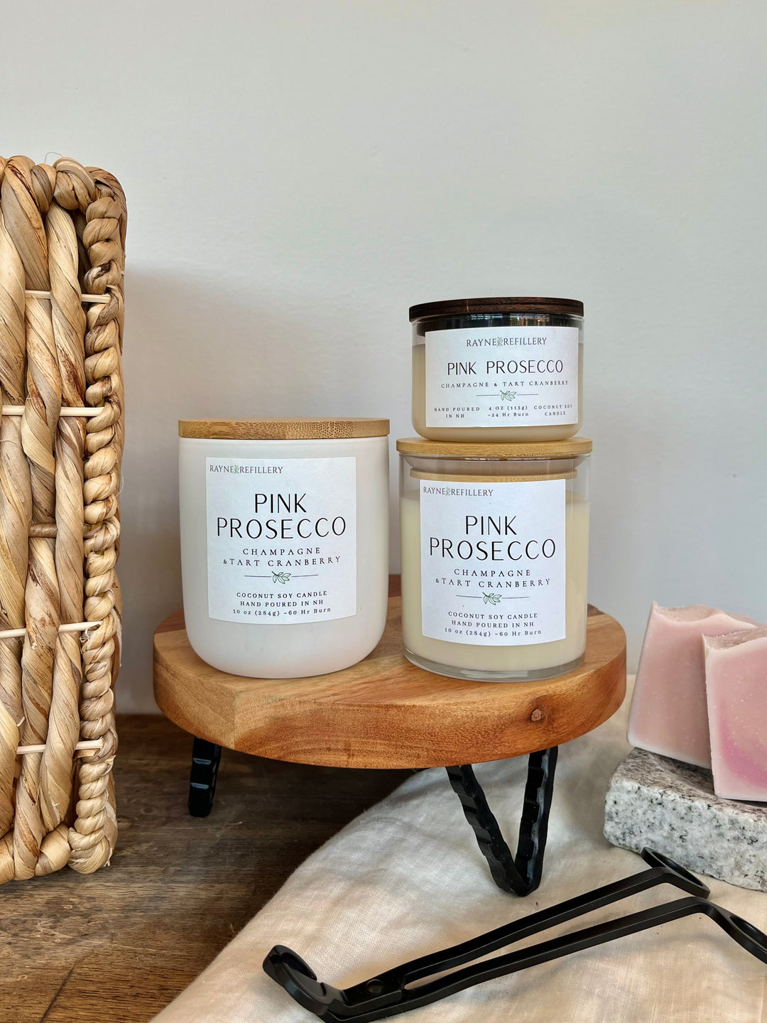 Coconut soy candle in white jar with gold lid; label reads Pink Prosecco