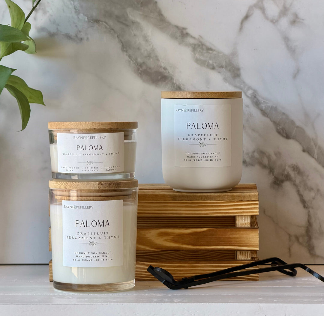 Coconut soy candle in white glass jar with wood lid; label shows grapefruit, bergamot & thyme