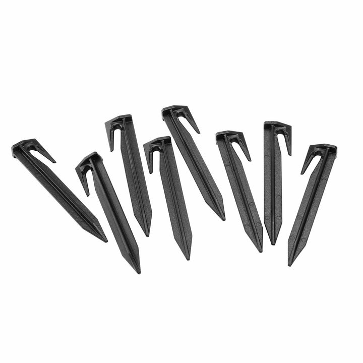 Metal staples with U-shaped heads, black finish, scattered row layout