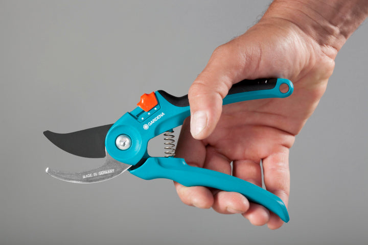 Garden pruners with turquoise handles, black blade, and orange pivot knob