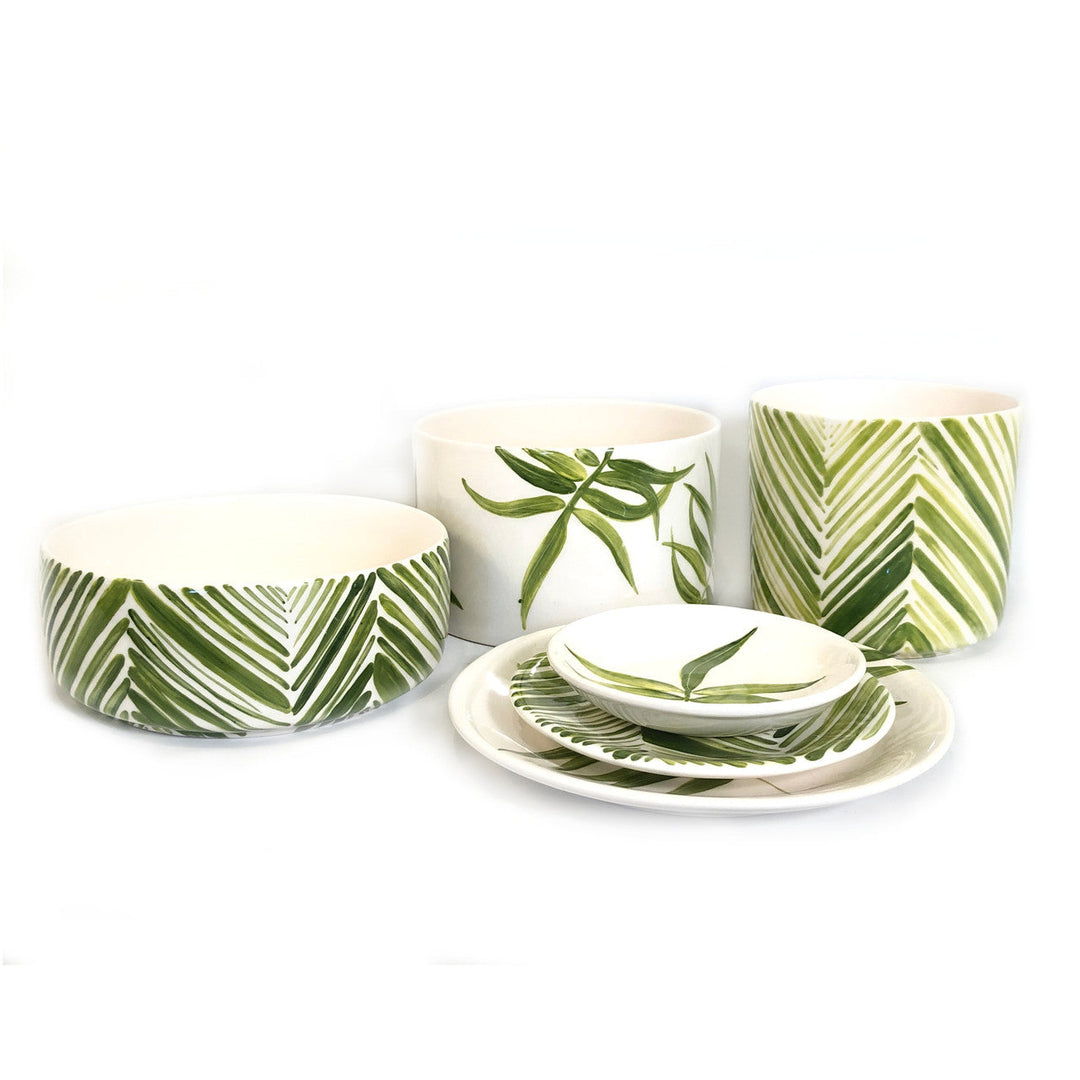 Green leaf cylinder serving bowl set with nested pieces and matching plates
