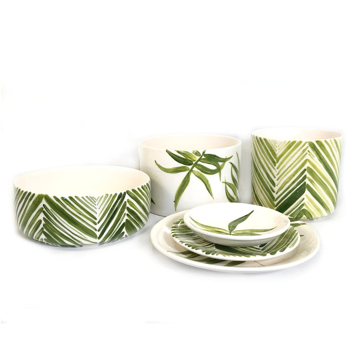 Green leaf cylinder serving bowl set with nested pieces and matching plates