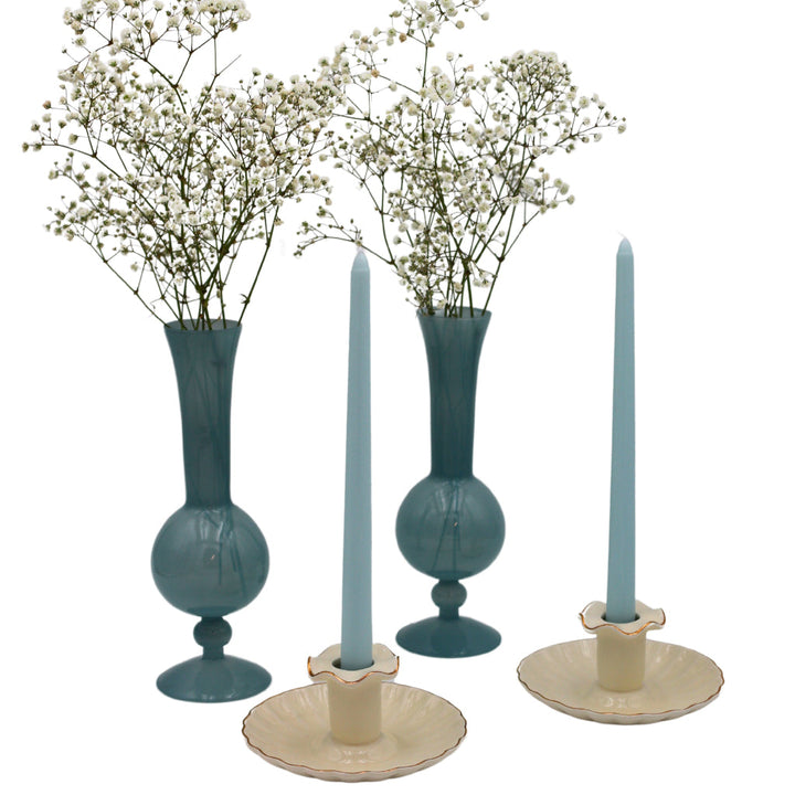 Cream ceramic candle holders with scalloped bases and gold-tone candle ring accents