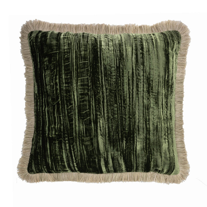 Green velvet throw pillow with beige fringed edges, 20 in by 20 in.