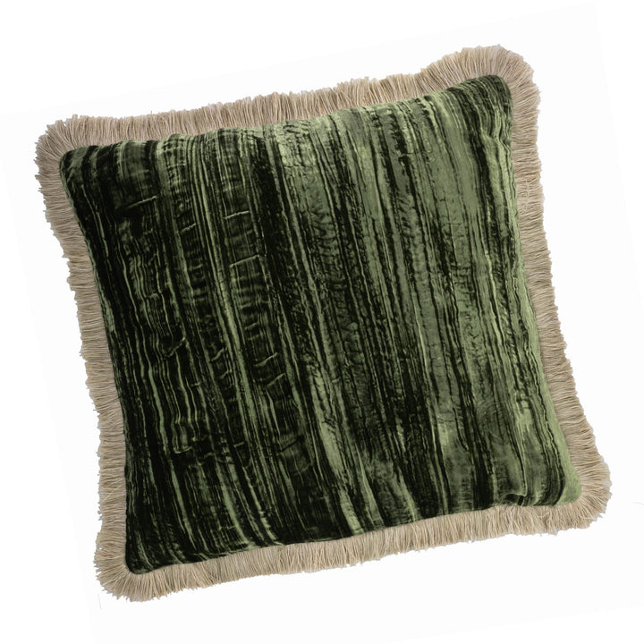 Square green velvet pillow with beige fringe trim along the edges, 20" x 20".